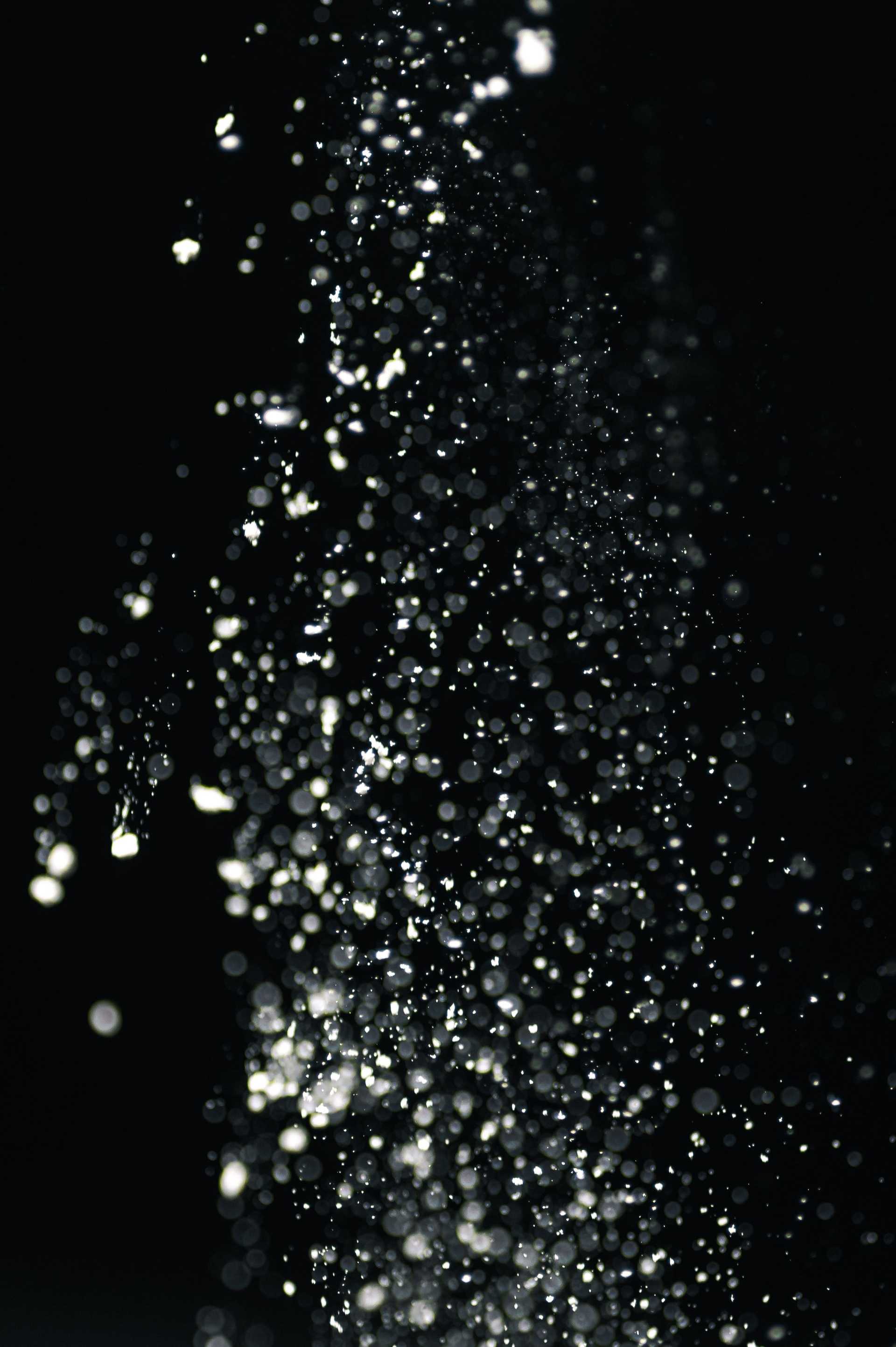 White Powder falling on black background